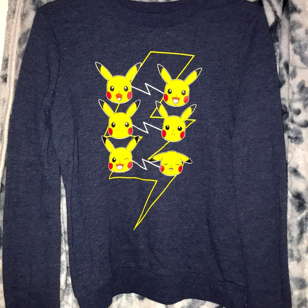 It is a Pikachu sweater the brand is doe